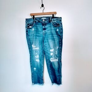 Ken Chen medium wash distressed jeans with raw hem.  Size 18